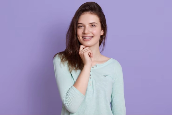 kid smiling after teeth surgery